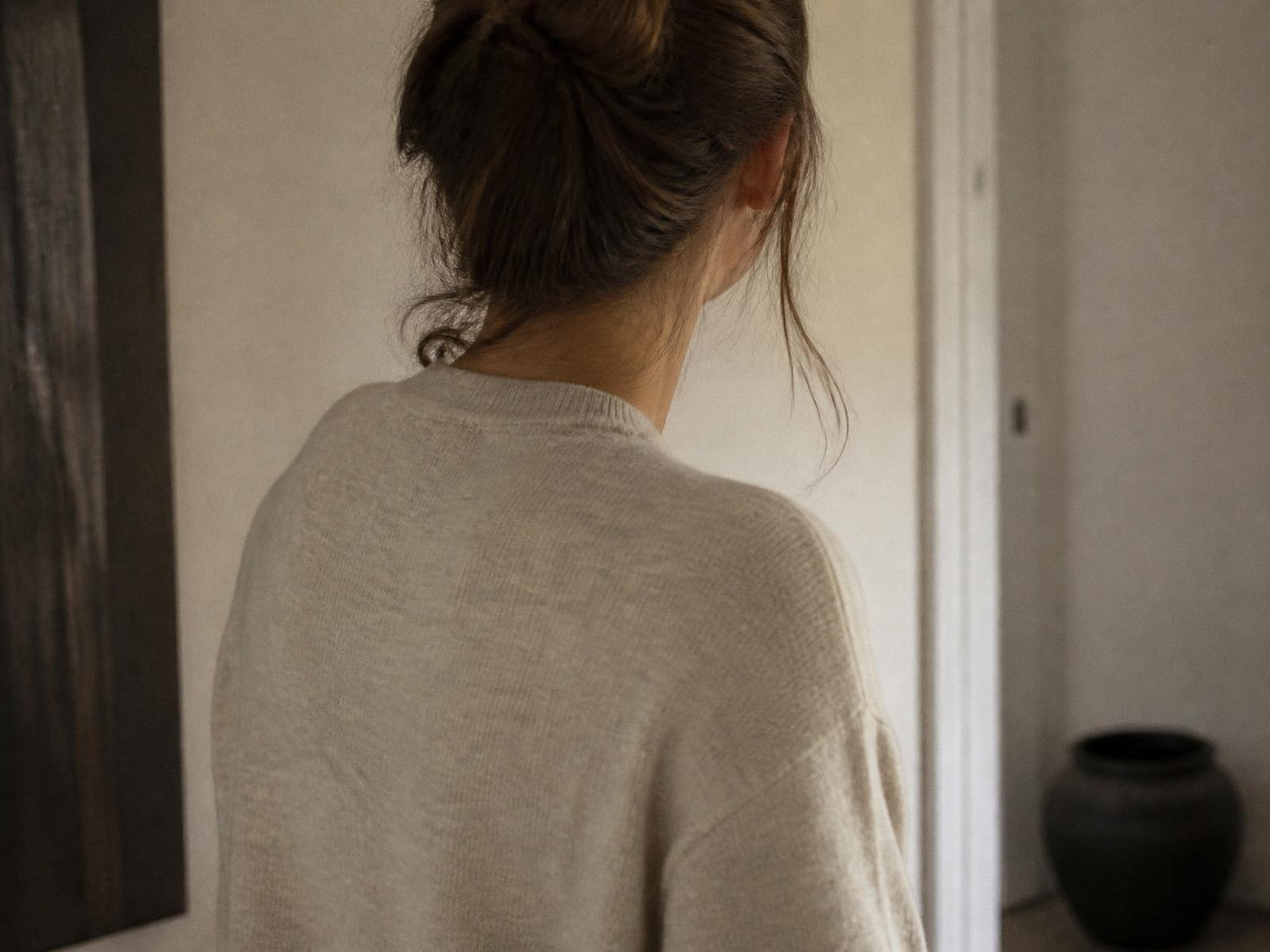 Visual interpretation of a woman wearing an early encouraging garment, seen away from the camera