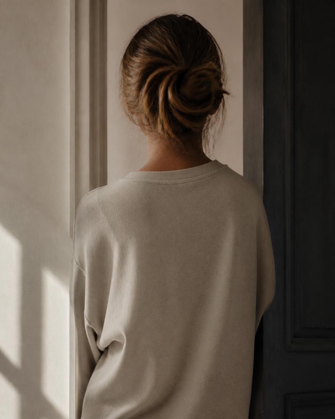 Visual interpretation of a woman wearing an early encouraging garment, seen in a quiet portrait composition